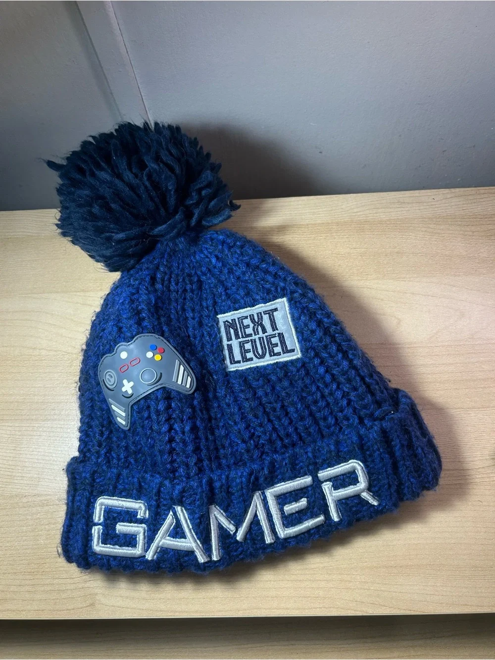 Place Blue Gamer Pom Beanie Hat with Game Controller Patch